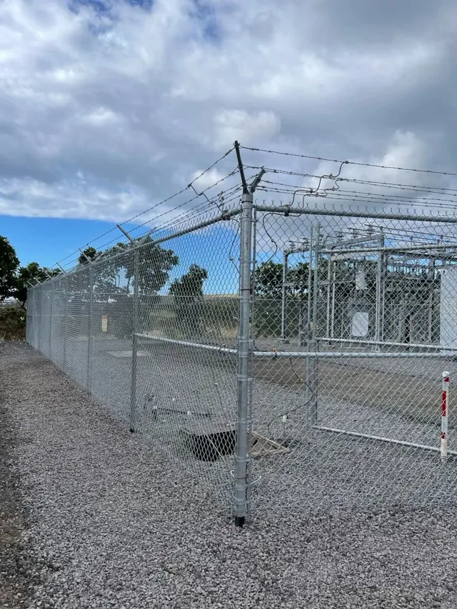 Chain link fence line along a Hilo property